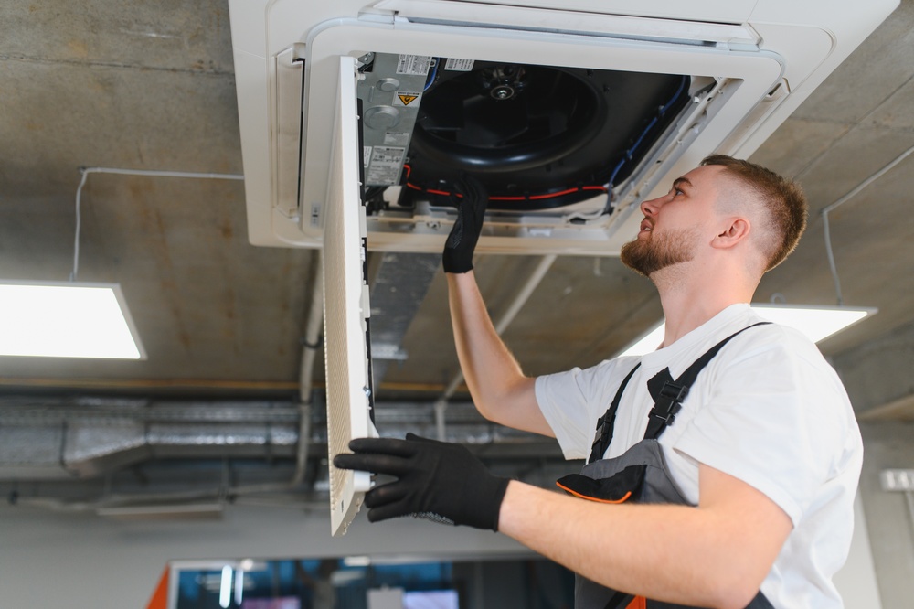 Licensed pest control technician inspecting a commercial building